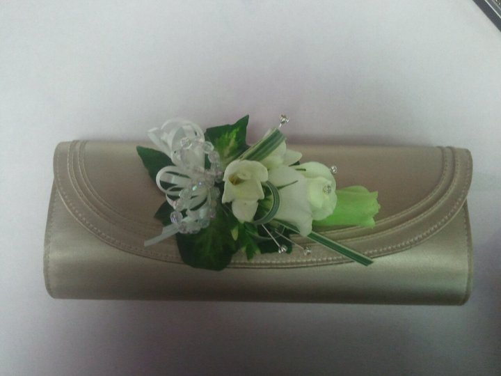 Eileen Jenkins rose, lizzianthus and freesia bag corsage.